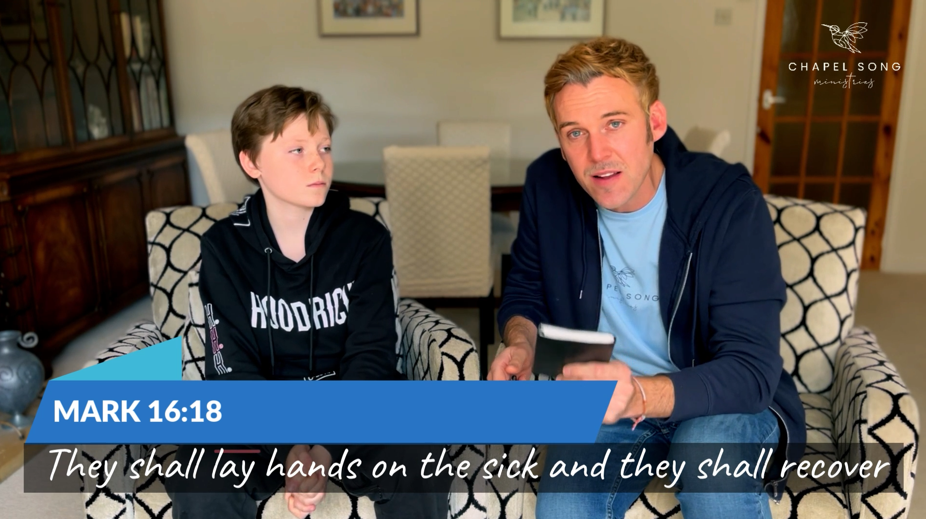 Load video: Rory and his son Fynn aged 12 sat next to each other in a lounge speaking about how God healed Rory&#39;s back through Fynn.